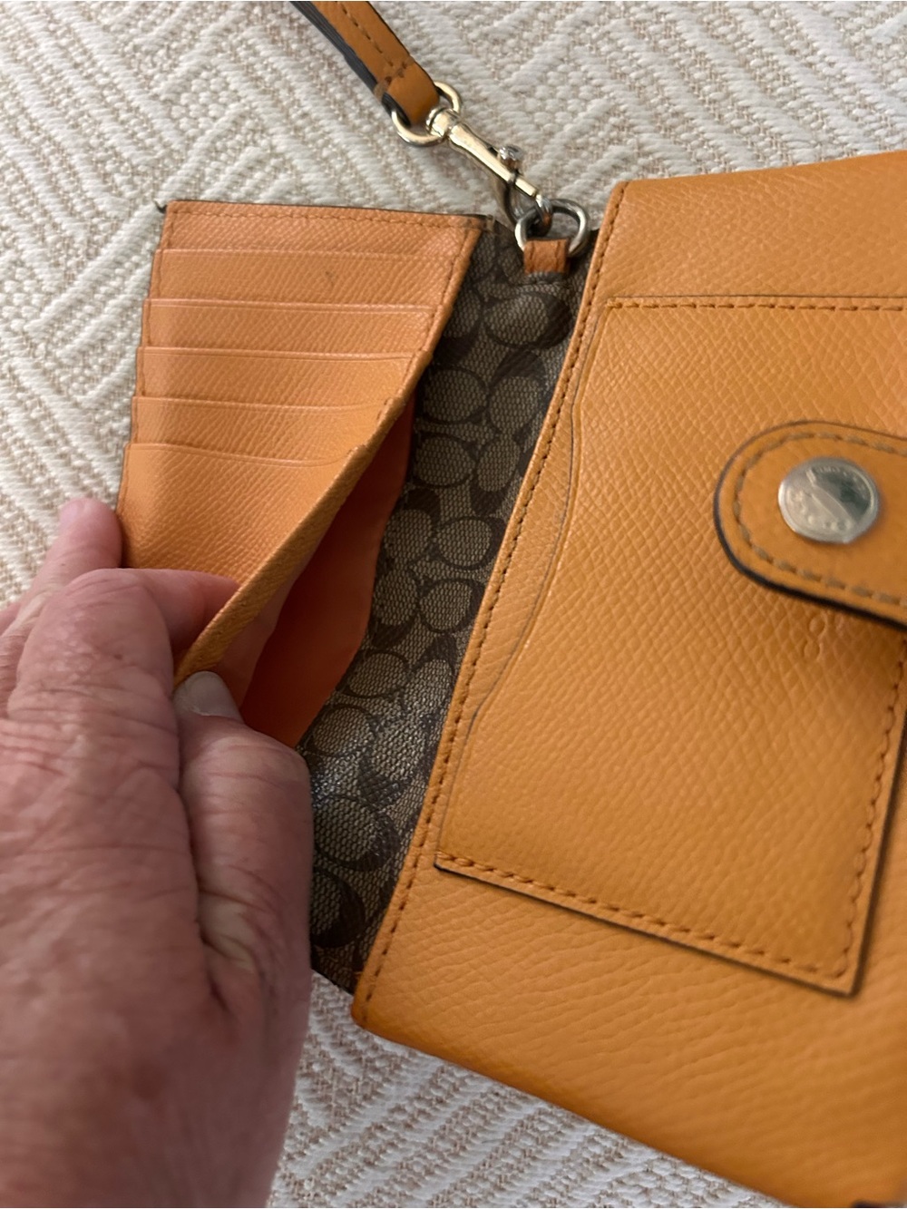 Coach wristlet wallet with snap closure. Yellow/orange pebbled leather. EUC - Picture 6 of 9